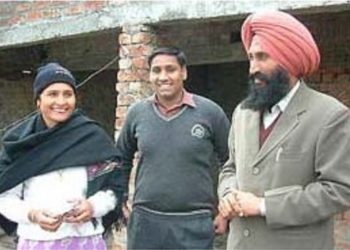 Balwinder Singh Bhikhiwind (right) with his wife and their son. File photo