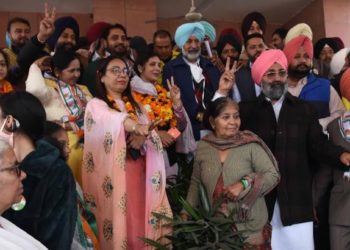 Led by Punjab Health and Family Minister, Balbir Singh Sidhu ( in blue turban) , Amarjeet Singh Jeeti Sidhu ( in green sweater) along with other Congress candidates file nomination papers at SDM office, Mohali on Tuesday.