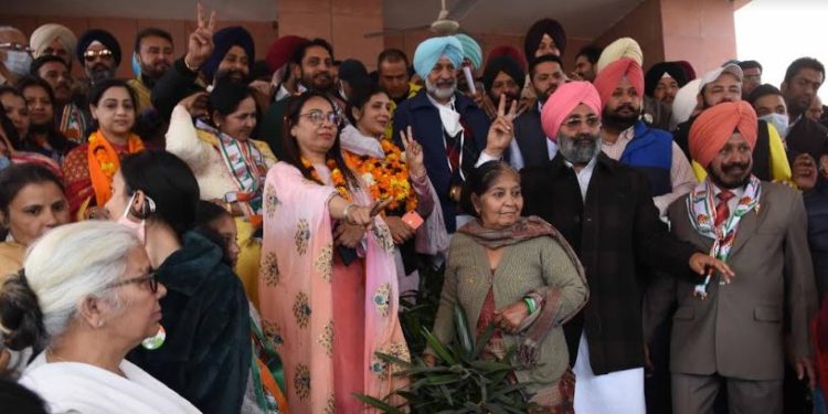 Led by Punjab Health and Family Minister, Balbir Singh Sidhu ( in blue turban) , Amarjeet Singh Jeeti Sidhu ( in green sweater) along with other Congress candidates file nomination papers at SDM office, Mohali on Tuesday.