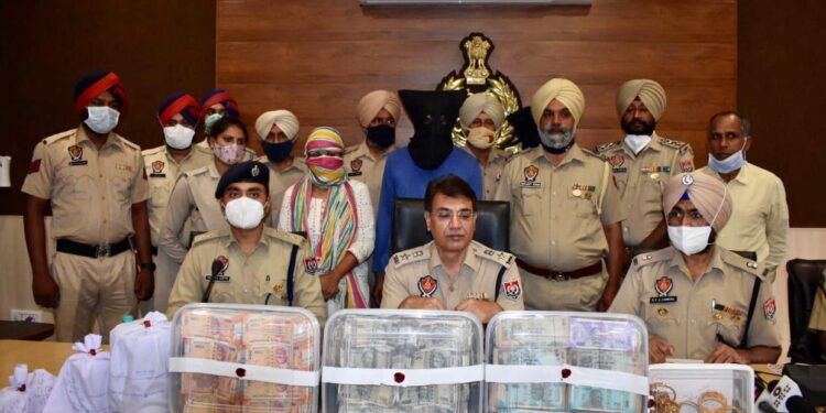 SSP Navjot Singh Mahal briefing about the arrest of three persons with drugs and drug money at Police Lines, Hoshiarpur on Wednesday.