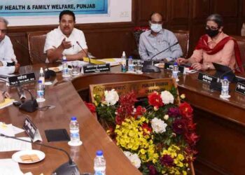 Photo Caption : Mr OP Soni presiding over the meeting of officials from various departments.