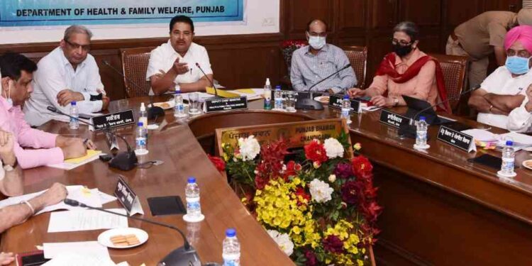 Photo Caption : Mr OP Soni presiding over the meeting of officials from various departments.