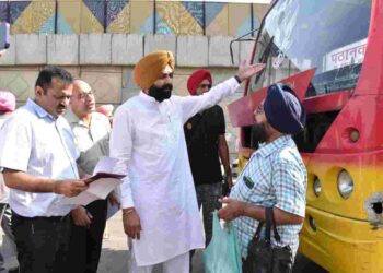 Punjab Transport Minister Laljit Singh Bhullar along with officials checking documents of buses plying on roads at local Rama Mandi Chowk and Kartarpur on Monday morning.