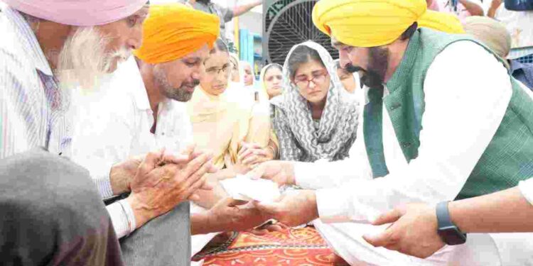 Chief Minister Bhagwant Mann on Sunday handed over cheques worth Rs 1 crore each as financial assistance to the distressed family members of the two brave hearts who had attained martyrdom on August 19 in a road accident at Leh