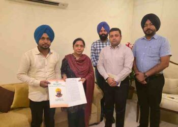 Dr. Baljit Kaur hands over appointment letters to two newly appointed employees of the Social Security Department