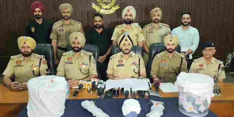 WOMAN, HER HUSBAND AND BROTHER USING LEASED GUAVA ORCHARD FOR CROSS-BORDER SMUGGLING HELD WITH 2 AK RIFLES, 10KG HEROIN